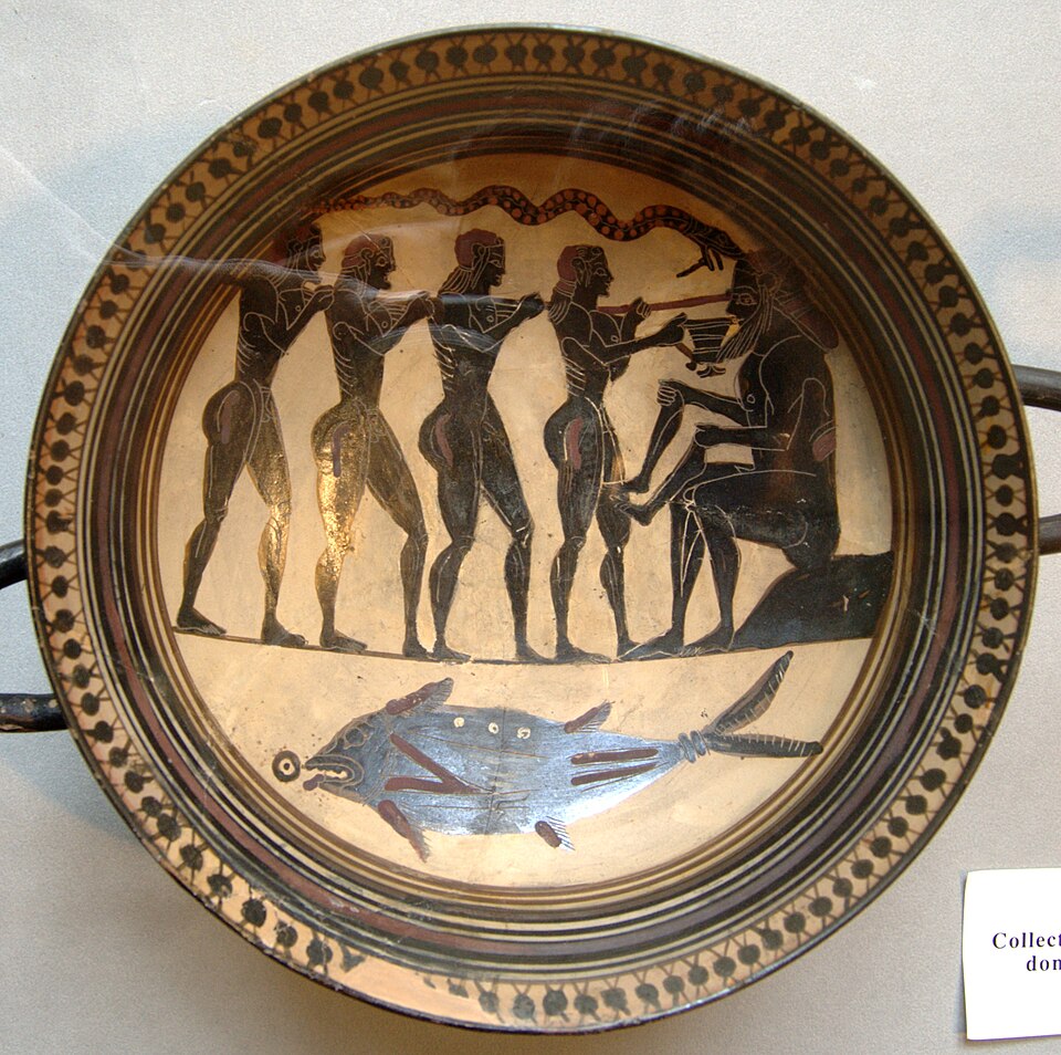 The interior of a Laconian cup: Polyphemos seated, holding human limbs, while Odysseus and his men drive a long stake into his single eye.